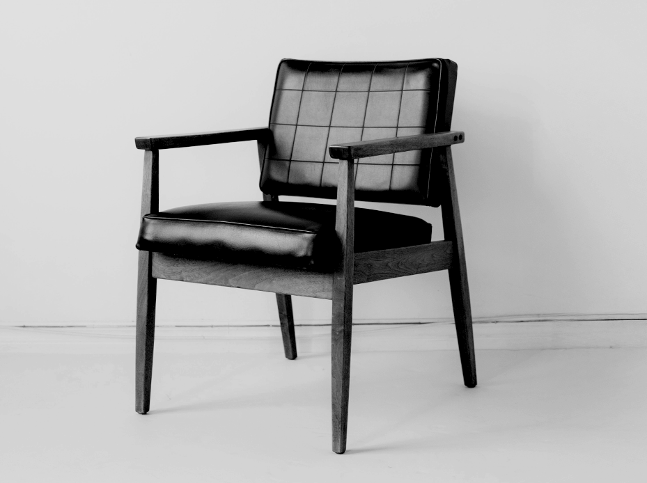 A padded armchair in black and white